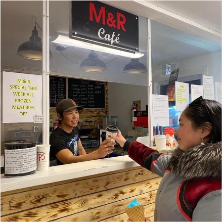 youth staff serving coffee at M&R cafe