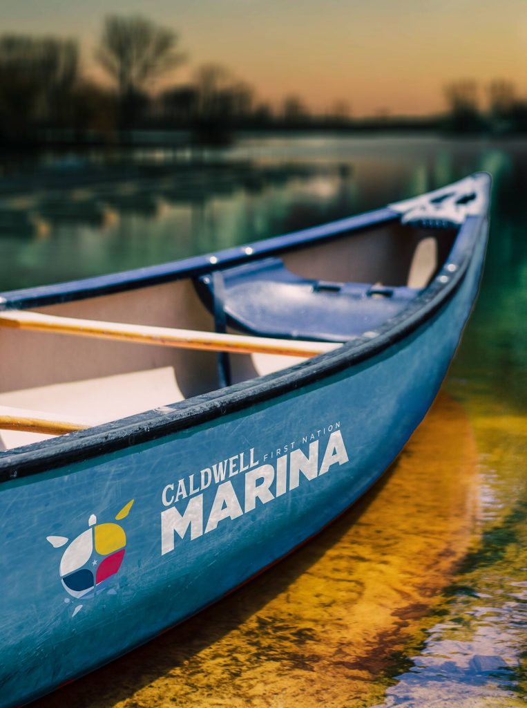 canoe with Caldwell First Nation Marina logo painted on the side